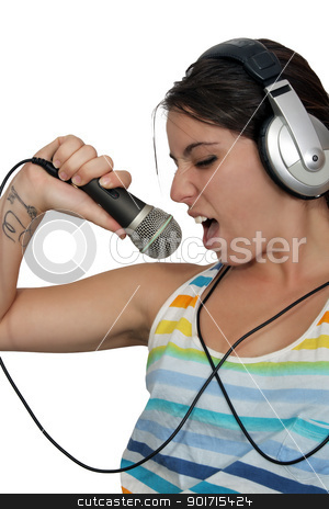 To use this stock image in your creative project, please select the size you need over to the right and click the "Add to Cart" button.
Your downloaded image will come with the Cutcaster watermark removed so don’t worry about the watermark you see on this page. Attractive Brunette with Headphones and a Microphone (4) stock photo, An attractive brunette sings along with music in her headphones, dressed in pajamas or sleepwear. Isolated on a white background with generous copyspace. by Carl Stewart
