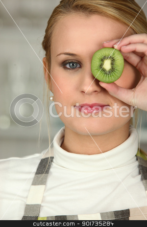 To use this stock image in your creative project, please select the size you need over to the right and click the "Add to Cart" button.
Your downloaded image will come with the Cutcaster watermark removed so don’t worry about the watermark you see on this page. Woman stood with slice of kiwi covering eye stock photo, Woman stood with slice of kiwi covering eye by photography33