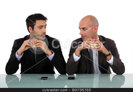 To use this stock image in your creative project, please select the size you need over to the right and click the "Add to Cart" button.
Your downloaded image will come with the Cutcaster watermark removed so don’t worry about the watermark you see on this page. duo of businessmen eating hamburger stock photo, duo of businessmen eating hamburger by photography33
