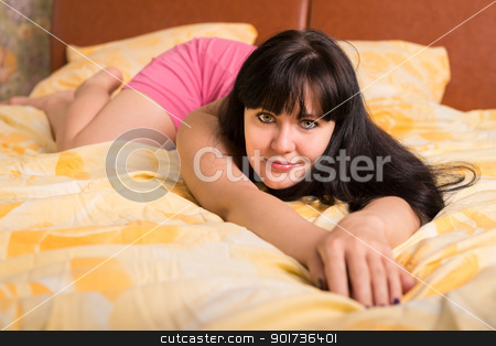 To use this stock image in your creative project, please select the size you need over to the right and click the "Add to Cart" button.
Your downloaded image will come with the Cutcaster watermark removed so don’t worry about the watermark you see on this page. Relaxing woman in a bed stock photo, Relaxing smiling woman in bed. Selective focus on eyes. by Iryna Rasko