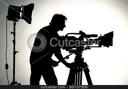 To use this stock image in your creative project, please select the size you need over to the right and click the "Add to Cart" button.
Your downloaded image will come with the Cutcaster watermark removed so don’t worry about the watermark you see on this page. Studio Lighting. stock photo, Searchlight and silhouette of the camera and cameraman. by Yury Ponomarev