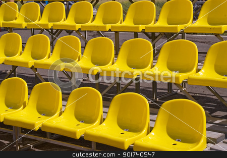 To use this stock image in your creative project, please select the size you need over to the right and click the "Add to Cart" button.
Your downloaded image will come with the Cutcaster watermark removed so don’t worry about the watermark you see on this page. Yellow seats. stock photo, Lines of yellow seats. by Yury Ponomarev