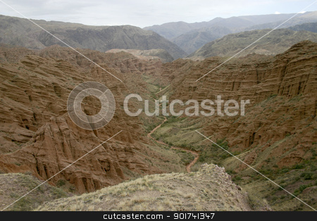 To use this stock image in your creative project, please select the size you need over to the right and click the "Add to Cart" button.
Your downloaded image will come with the Cutcaster watermark removed so don’t worry about the watermark you see on this page. Red canyon. stock photo, Red canyon. Dry channel of the river on a background of red mountains. by Yury Ponomarev