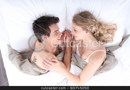 To use this stock image in your creative project, please select the size you need over to the right and click the "Add to Cart" button.
Your downloaded image will come with the Cutcaster watermark removed so don’t worry about the watermark you see on this page. Young couple in bed stock photo, Young couple in bed by photography33
