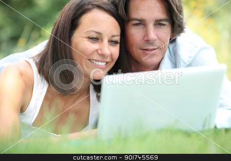 To use this stock image in your creative project, please select the size you need over to the right and click the "Add to Cart" button.
Your downloaded image will come with the Cutcaster watermark removed so don’t worry about the watermark you see on this page. Couple on laptop stock photo, Couple on laptop by photography33