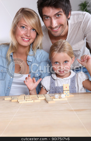 To use this stock image in your creative project, please select the size you need over to the right and click the "Add to Cart" button.
Your downloaded image will come with the Cutcaster watermark removed so don’t worry about the watermark you see on this page. Parents and daughter playing dominoes stock photo, Parents and daughter playing dominoes by photography33