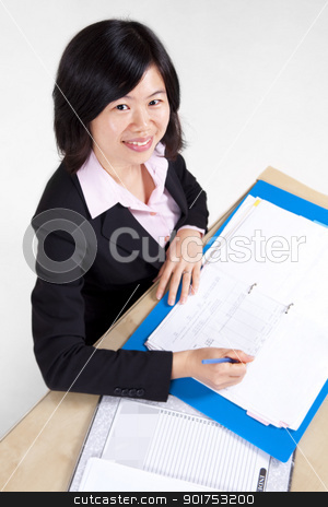 To use this stock image in your creative project, please select the size you need over to the right and click the "Add to Cart" button.
Your downloaded image will come with the Cutcaster watermark removed so don’t worry about the watermark you see on this page. Businesswoman signing document. stock photo, A businesswoman sitting at the table with document. by szefei