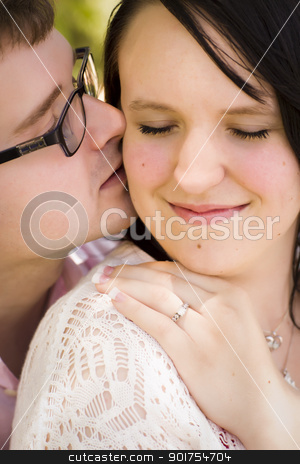 To use this stock image in your creative project, please select the size you need over to the right and click the "Add to Cart" button.
Your downloaded image will come with the Cutcaster watermark removed so don’t worry about the watermark you see on this page. Young Engaged Couple Sharing a Moment in the Park stock photo, Attractive Young Engaged Couple Sharing an Intimate Moment in the Park. by Andy Dean