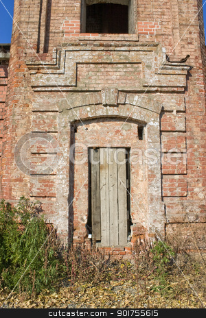 To use this stock image in your creative project, please select the size you need over to the right and click the "Add to Cart" button.
Your downloaded image will come with the Cutcaster watermark removed so don’t worry about the watermark you see on this page. Old brick tower. stock photo, Window and closed door in an old building. by Yury Ponomarev