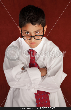 To use this stock image in your creative project, please select the size you need over to the right and click the "Add to Cart" button.
Your downloaded image will come with the Cutcaster watermark removed so don’t worry about the watermark you see on this page. Daddy's Son stock photo, Cute young boy in his father's shirt and eyeglasses by Scott Griessel