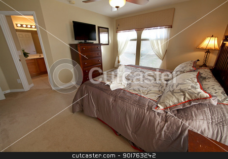 To use this stock image in your creative project, please select the size you need over to the right and click the "Add to Cart" button.
Your downloaded image will come with the Cutcaster watermark removed so don’t worry about the watermark you see on this page. King Master Bedroom stock photo, A King Master Bedroom, Interior Shot of a Home by Lucy Clark
