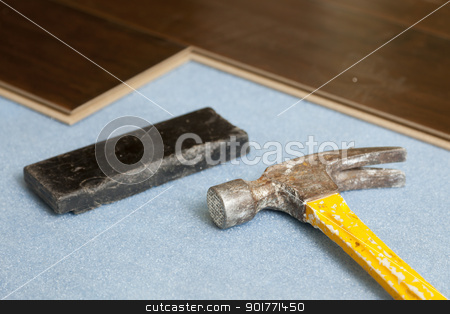 To use this stock image in your creative project, please select the size you need over to the right and click the "Add to Cart" button.
Your downloaded image will come with the Cutcaster watermark removed so don’t worry about the watermark you see on this page. Hammer and Block with New Laminate Flooring stock photo, Hammer and Block with New Laminate Flooring Abstract. by Andy Dean