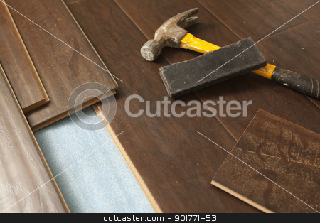 To use this stock image in your creative project, please select the size you need over to the right and click the "Add to Cart" button.
Your downloaded image will come with the Cutcaster watermark removed so don’t worry about the watermark you see on this page. Hammer and Block with New Laminate Flooring stock photo, Hammer and Block with New Laminate Flooring Abstract. by Andy Dean