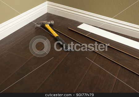 To use this stock image in your creative project, please select the size you need over to the right and click the "Add to Cart" button.
Your downloaded image will come with the Cutcaster watermark removed so don’t worry about the watermark you see on this page. Hammer, Laminate Flooring and New Baseboard Molding stock photo, Hammer, Laminate Flooring and New Baseboard Molding Abstract. by Andy Dean