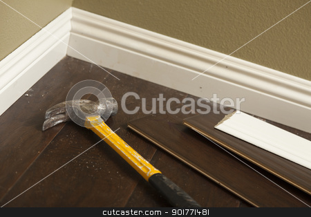 To use this stock image in your creative project, please select the size you need over to the right and click the "Add to Cart" button.
Your downloaded image will come with the Cutcaster watermark removed so don’t worry about the watermark you see on this page. Hammer, Laminate Flooring and New Baseboard Molding stock photo, Hammer, Laminate Flooring and New Baseboard Molding Abstract. by Andy Dean