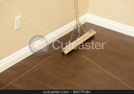 To use this stock image in your creative project, please select the size you need over to the right and click the "Add to Cart" button.
Your downloaded image will come with the Cutcaster watermark removed so don’t worry about the watermark you see on this page. Push Broom on a Newly Installed Laminate Floor and Baseboard stock photo, Push Broom on a Newly Installed Laminate Floor and New Baseboards. by Andy Dean