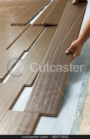 To use this stock image in your creative project, please select the size you need over to the right and click the "Add to Cart" button.
Your downloaded image will come with the Cutcaster watermark removed so don’t worry about the watermark you see on this page. Man Installing New Laminate Wood Flooring stock photo, Man Installing New Laminate Wood Flooring Abstract. by Andy Dean