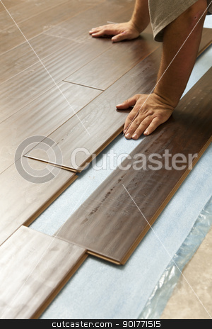 To use this stock image in your creative project, please select the size you need over to the right and click the "Add to Cart" button.
Your downloaded image will come with the Cutcaster watermark removed so don’t worry about the watermark you see on this page. Man Installing New Laminate Wood Flooring stock photo, Man Installing New Laminate Wood Flooring Abstract. by Andy Dean