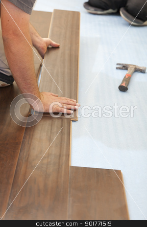 To use this stock image in your creative project, please select the size you need over to the right and click the "Add to Cart" button.
Your downloaded image will come with the Cutcaster watermark removed so don’t worry about the watermark you see on this page. Man Installing New Laminate Wood Flooring stock photo, Man Installing New Laminate Wood Flooring Abstract. by Andy Dean