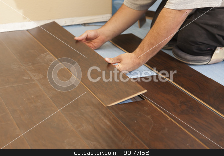 To use this stock image in your creative project, please select the size you need over to the right and click the "Add to Cart" button.
Your downloaded image will come with the Cutcaster watermark removed so don’t worry about the watermark you see on this page. Man Installing New Laminate Wood Flooring stock photo, Man Installing New Laminate Wood Flooring Abstract. by Andy Dean