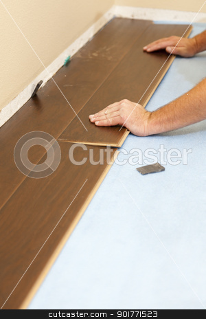 To use this stock image in your creative project, please select the size you need over to the right and click the "Add to Cart" button.
Your downloaded image will come with the Cutcaster watermark removed so don’t worry about the watermark you see on this page. Man Installing New Laminate Wood Flooring stock photo, Man Installing New Laminate Wood Flooring Abstract. by Andy Dean