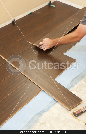 To use this stock image in your creative project, please select the size you need over to the right and click the "Add to Cart" button.
Your downloaded image will come with the Cutcaster watermark removed so don’t worry about the watermark you see on this page. Man Installing New Laminate Wood Flooring stock photo, Man Installing New Laminate Wood Flooring Abstract. by Andy Dean