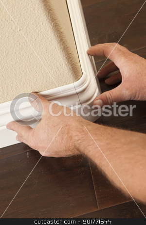To use this stock image in your creative project, please select the size you need over to the right and click the "Add to Cart" button.
Your downloaded image will come with the Cutcaster watermark removed so don’t worry about the watermark you see on this page. Contractor Installing New Baseboard with Bull Nose Corners and N stock photo, Contractor Installing New Baseboard with Bull Nose Corners and New Laminate Flooring Renovation Abstract. by Andy Dean