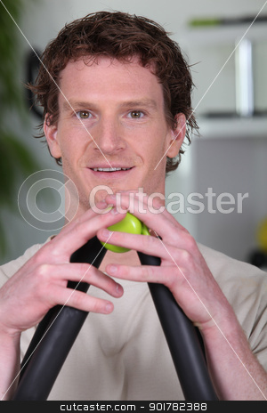To use this stock image in your creative project, please select the size you need over to the right and click the "Add to Cart" button.
Your downloaded image will come with the Cutcaster watermark removed so don’t worry about the watermark you see on this page. Man using a resistance exerciser stock photo, Man using a resistance exerciser by photography33
