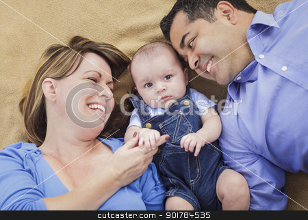 To use this stock image in your creative project, please select the size you need over to the right and click the "Add to Cart" button.
Your downloaded image will come with the Cutcaster watermark removed so don’t worry about the watermark you see on this page. Mixed Race Family Playing on the Blanket stock photo, Mixed Race Family Playing Face Up on the Blanket. by Andy Dean