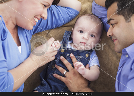 To use this stock image in your creative project, please select the size you need over to the right and click the "Add to Cart" button.
Your downloaded image will come with the Cutcaster watermark removed so don’t worry about the watermark you see on this page. Mixed Race Family Playing on the Blanket stock photo, Mixed Race Family Playing Face Up on the Blanket. by Andy Dean