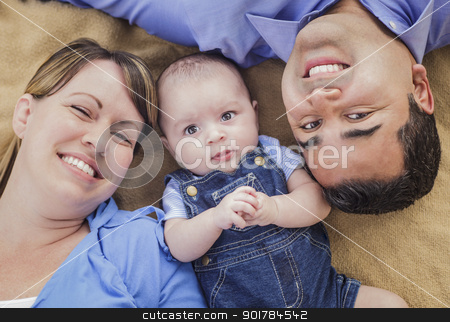 To use this stock image in your creative project, please select the size you need over to the right and click the "Add to Cart" button.
Your downloaded image will come with the Cutcaster watermark removed so don’t worry about the watermark you see on this page. Mixed Race Family Playing on the Blanket stock photo, Mixed Race Family Playing Face Up on the Blanket. by Andy Dean