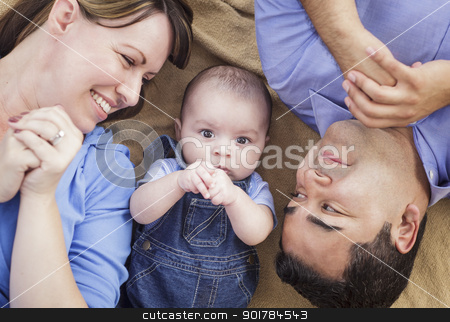 To use this stock image in your creative project, please select the size you need over to the right and click the "Add to Cart" button.
Your downloaded image will come with the Cutcaster watermark removed so don’t worry about the watermark you see on this page. Mixed Race Family Playing on the Blanket stock photo, Mixed Race Family Playing Face Up on the Blanket. by Andy Dean