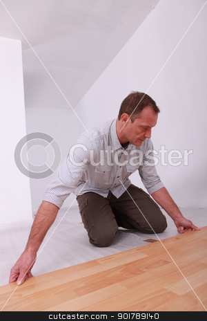 To use this stock image in your creative project, please select the size you need over to the right and click the "Add to Cart" button.
Your downloaded image will come with the Cutcaster watermark removed so don’t worry about the watermark you see on this page. Man installing wooden flooring stock photo, Man installing wooden flooring by photography33