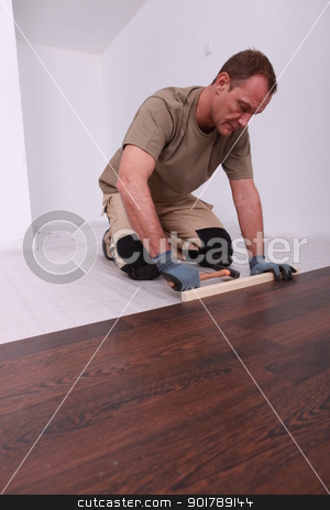 To use this stock image in your creative project, please select the size you need over to the right and click the "Add to Cart" button.
Your downloaded image will come with the Cutcaster watermark removed so don’t worry about the watermark you see on this page. Man laying a wooden floor stock photo, Man laying a wooden floor by photography33