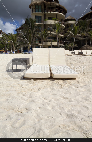 To use this stock image in your creative project, please select the size you need over to the right and click the "Add to Cart" button.
Your downloaded image will come with the Cutcaster watermark removed so don’t worry about the watermark you see on this page. Beach Chairs stock photo, A pair of beach lounge chairs by Kevin Tietz