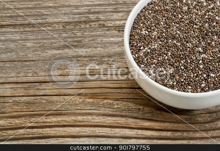 To use this stock image in your creative project, please select the size you need over to the right and click the "Add to Cart" button.
Your downloaded image will come with the Cutcaster watermark removed so don’t worry about the watermark you see on this page. chia seeds stock photo, chia seeds - white ceramic bowl on a grained wood, copy space by Marek Uliasz