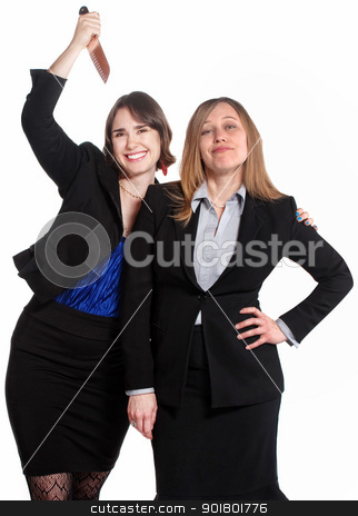 To use this stock image in your creative project, please select the size you need over to the right and click the "Add to Cart" button.
Your downloaded image will come with the Cutcaster watermark removed so don’t worry about the watermark you see on this page. Backstabbing Employee stock photo, Smiling woman holds a knife behind clueless coworker by Scott Griessel