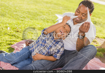 To use this stock image in your creative project, please select the size you need over to the right and click the "Add to Cart" button.
Your downloaded image will come with the Cutcaster watermark removed so don’t worry about the watermark you see on this page. Mixed Race Father and Son Playing with Paper Airplanes stock photo, Happy African American Father and Mixed Race Son Playing with Paper Airplanes in the Park.
by Andy Dean