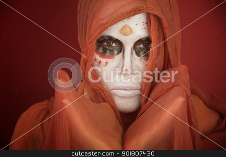 To use this stock image in your creative project, please select the size you need over to the right and click the "Add to Cart" button.
Your downloaded image will come with the Cutcaster watermark removed so don’t worry about the watermark you see on this page. Day of the Dead stock photo, A lady with dramatic All Souls Day makeup and a orange scarf by Scott Griessel