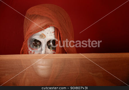 To use this stock image in your creative project, please select the size you need over to the right and click the "Add to Cart" button.
Your downloaded image will come with the Cutcaster watermark removed so don’t worry about the watermark you see on this page. Woman dressed for Day of the Dead stock photo, Woman with makeup for Day of the Dead and a scarf in front of her mouth. by Scott Griessel