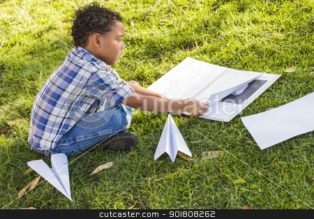 To use this stock image in your creative project, please select the size you need over to the right and click the "Add to Cart" button.
Your downloaded image will come with the Cutcaster watermark removed so don’t worry about the watermark you see on this page. Mixed Race Boy Learning How to Fold Paper Airplanes stock photo, Mixed Race Boy Learning How to Fold Paper Airplanes Outdoors on the Grass. by Andy Dean