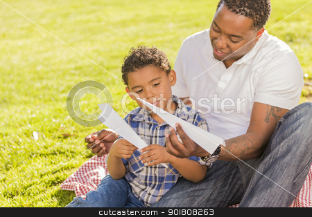 To use this stock image in your creative project, please select the size you need over to the right and click the "Add to Cart" button.
Your downloaded image will come with the Cutcaster watermark removed so don’t worry about the watermark you see on this page. Mixed Race Father and Son Playing with Paper Airplanes stock photo, Happy Mixed Race Father and Son Playing with Paper Airplanes in the Park.
by Andy Dean