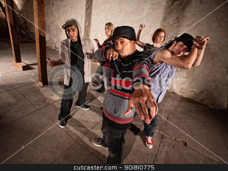 To use this stock image in your creative project, please select the size you need over to the right and click the "Add to Cart" button.
Your downloaded image will come with the Cutcaster watermark removed so don’t worry about the watermark you see on this page. Mexcian Break Dancer with Group stock photo, Cool Mexican break dancers in underground setting by Scott Griessel