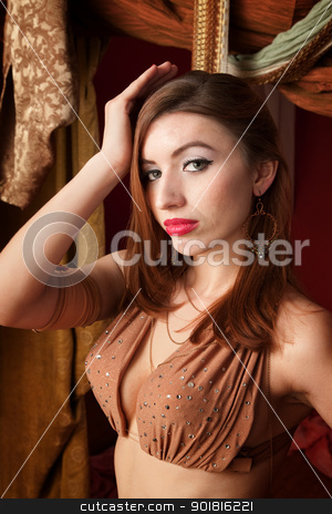 To use this stock image in your creative project, please select the size you need over to the right and click the "Add to Cart" button.
Your downloaded image will come with the Cutcaster watermark removed so don’t worry about the watermark you see on this page. Gorgeous Belly Dancer stock photo, Gorgeous Arab Belly Dancer with hand on head by Scott Griessel
