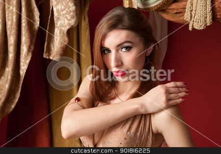To use this stock image in your creative project, please select the size you need over to the right and click the "Add to Cart" button.
Your downloaded image will come with the Cutcaster watermark removed so don’t worry about the watermark you see on this page. Beautiful Belly Dancer stock photo, Beautiful Arab belly dancer with her hand on shoulder by Scott Griessel