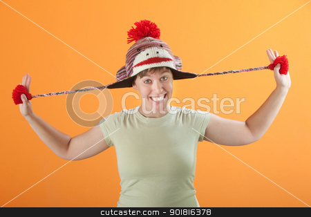 To use this stock image in your creative project, please select the size you need over to the right and click the "Add to Cart" button.
Your downloaded image will come with the Cutcaster watermark removed so don’t worry about the watermark you see on this page. Woman Pulling Her Hat stock photo, Young Caucasian lady in a playful mood stretching her hat by Scott Griessel