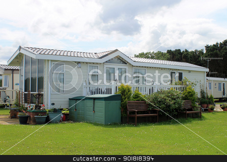 To use this stock image in your creative project, please select the size you need over to the right and click the "Add to Cart" button.
Your downloaded image will come with the Cutcaster watermark removed so don’t worry about the watermark you see on this page. Modern static caravan on campsite stock photo, Modern static caravan on campsite during summer, holiday or vacation scene. by Martin Crowdy