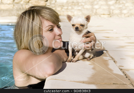 To use this stock image in your creative project, please select the size you need over to the right and click the "Add to Cart" button.
Your downloaded image will come with the Cutcaster watermark removed so don’t worry about the watermark you see on this page. chihuahua and girl in the swimming pool stock photo, portrait of a cute purebred chihuahua and young woman in the swimming pool by Bonzami Emmanuelle
