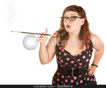 To use this stock image in your creative project, please select the size you need over to the right and click the "Add to Cart" button.
Your downloaded image will come with the Cutcaster watermark removed so don’t worry about the watermark you see on this page. Woman Blowing Smoke Rings stock photo, Beautiful woman in pink polka dot with cigarette holder by Scott Griessel