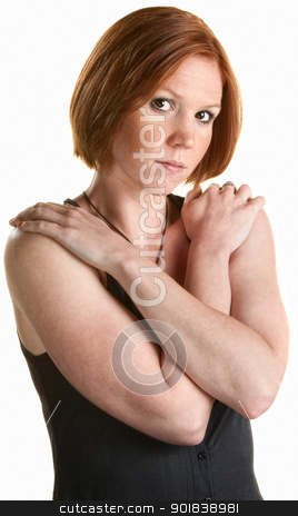 To use this stock image in your creative project, please select the size you need over to the right and click the "Add to Cart" button.
Your downloaded image will come with the Cutcaster watermark removed so don’t worry about the watermark you see on this page. Serious Woman Holding Shoulders stock photo, Serious red head with hands on shoulders over white background by Scott Griessel